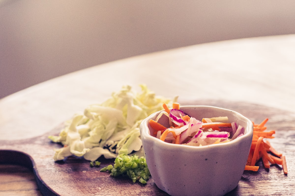 A small bowl of coleslaw with shredded cabbage and carrots