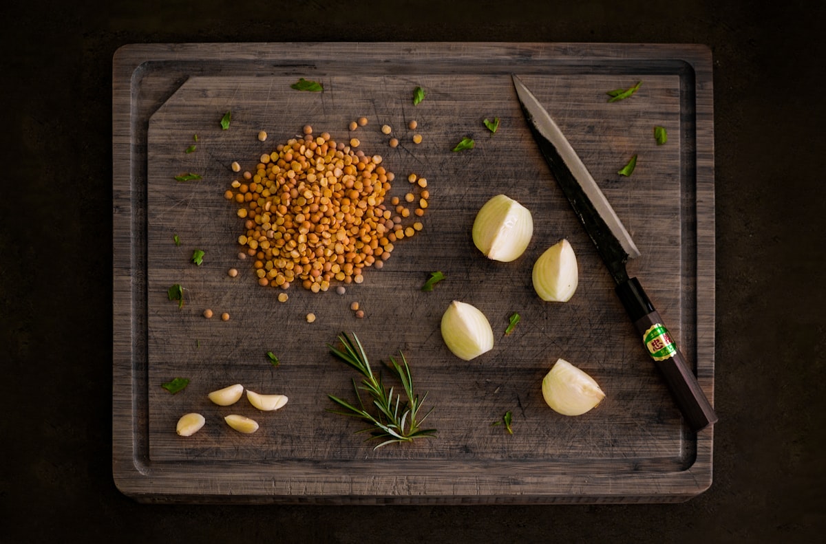 brown wooden handled knife on brown wooden chopping board