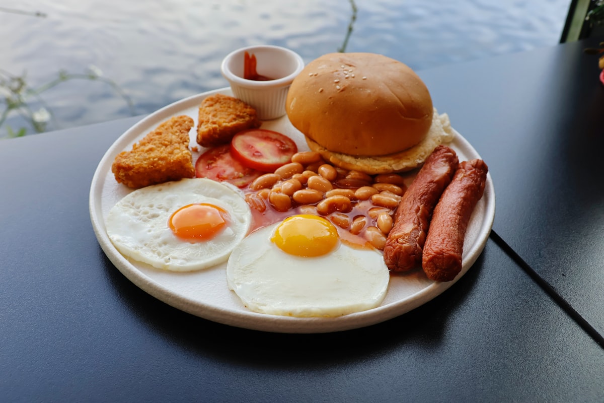 Full english breakfast with eggs, sausages, and beans